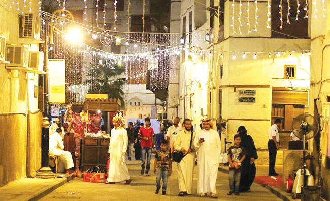 People walk through Jeddah’s historical area Al-Balad during the holy month of Ramadan. (Reuters)