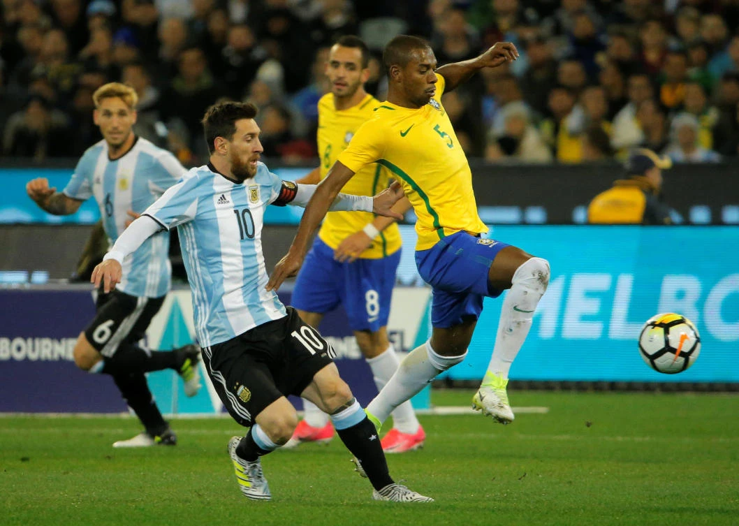 Argentina's Lionel Messi in action with Brazil's Fernandinho during their international friendly at the Melbourne Cricket Ground on Friday. (Reuters)