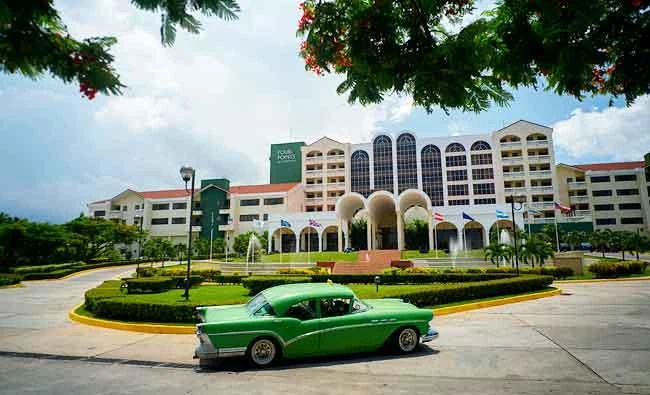 In this June 28, 2016 file photo, a vintage car passes in front of the Four Points by Sheraton hotel in Havana, Cuba. (AP)