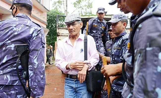 This file photo taken on May 26, 2014 shows French serial killer Charles Sobhraj (C) being brought to the district court for a hearing on a case related to the murder of Canadian backpacker Laurent Ormond Carriere, in Bhaktapur. (AFP)
