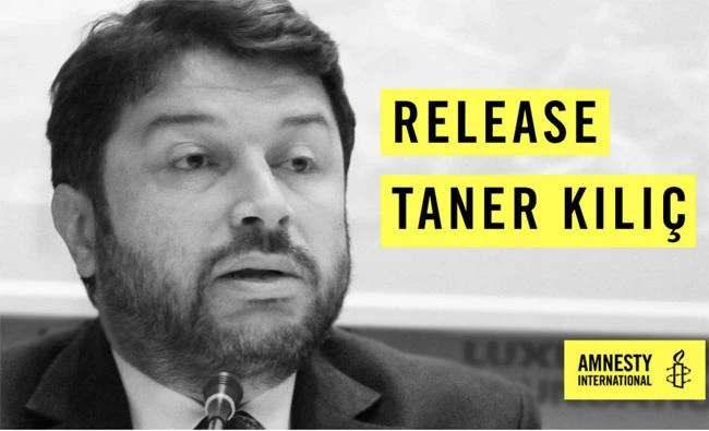 Taner Kilic, chairman of Amnesty International Turkey, is shown in this AI campaign poster seeking his release by Turkish authorities. (Amnesty International photo)