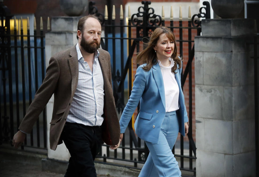 Prime Minister Theresa May's chief of staff Nick Timothy and Joint-chief of staff Fiona Hill leave Conservative Party headquarters in London on Friday. (AP)