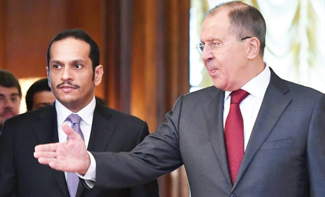 Russian Foreign Minister Sergei Lavrov, right, welcomes his Qatari counterpart Sheikh Mohammed bin Abdulrahman Al-Thani during their meeting in Moscow Saturday.(AFP)