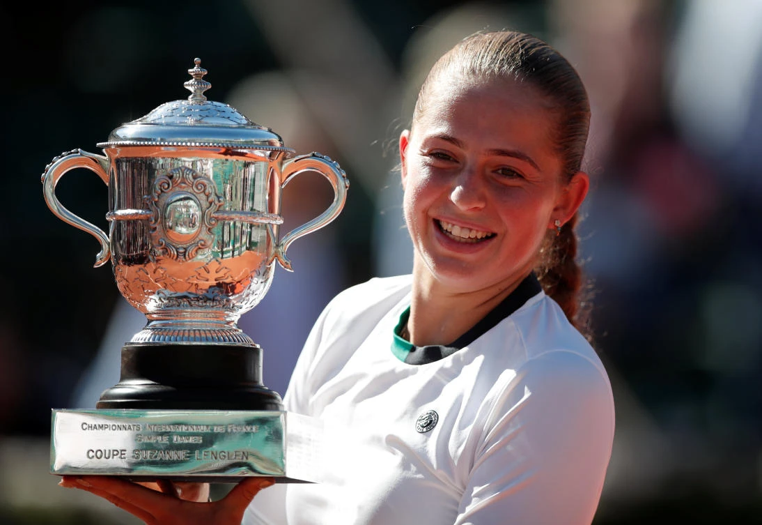Latvia's Jelena Ostapenko celebrates with the trophy after winning the final against Romania's Simona Halep in the French Open on Saturday at Roland Garros. (AFP)