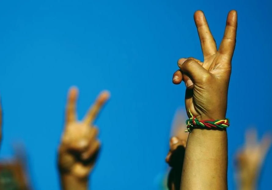 You might want to think twice before doing the peace sign when you pose for a photo (Reuters)