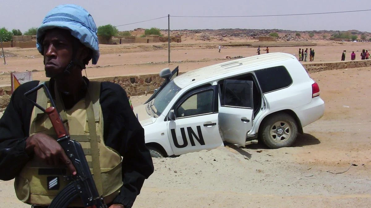 A soldier from the UN peacekeeping mission in Mali stands guard near a vehicle after it drove over an explosive device near Kidal in this file photo. (AFP)