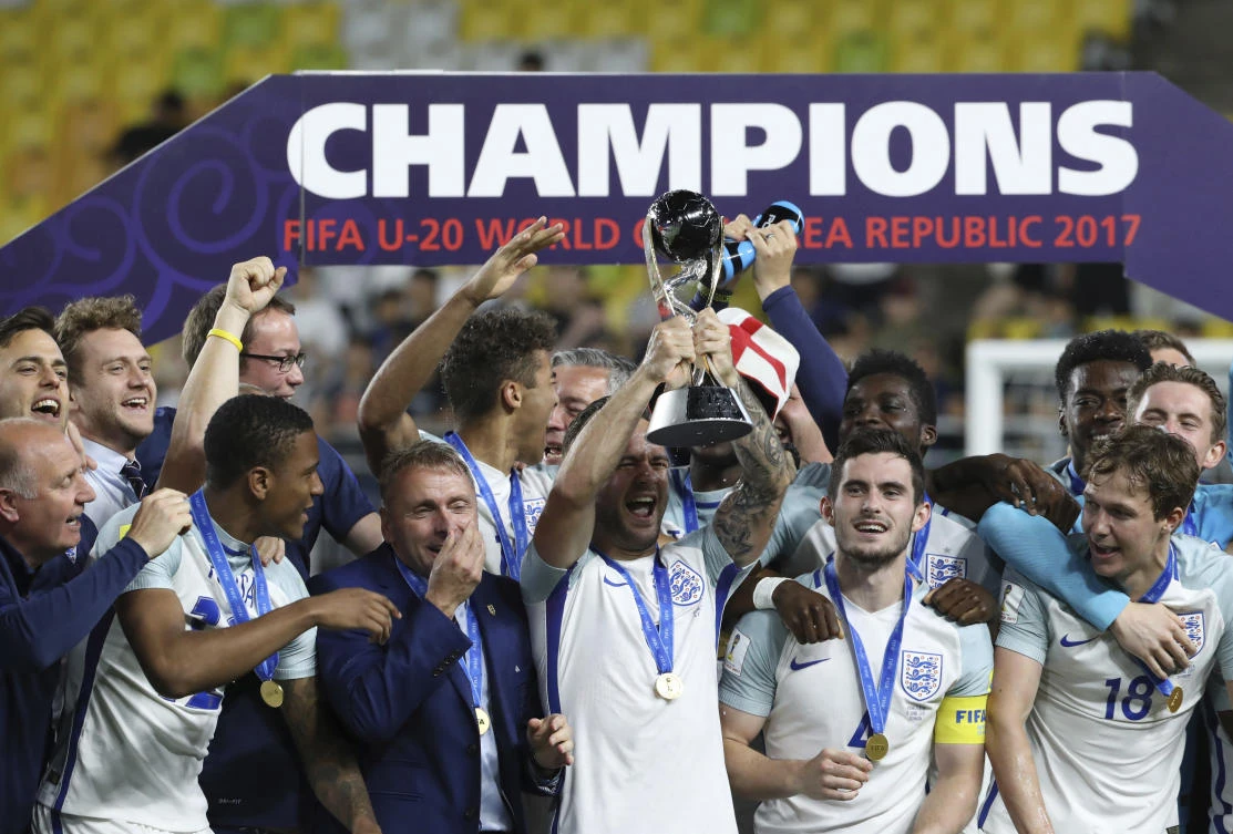 England players celebrate with the trophy after defeating Venezuela during the final match of the FIFA U-20 World Cup Korea 2017 at Suwon World Cup Stadium in Suwon, South Korea, on Sunday. (AP)