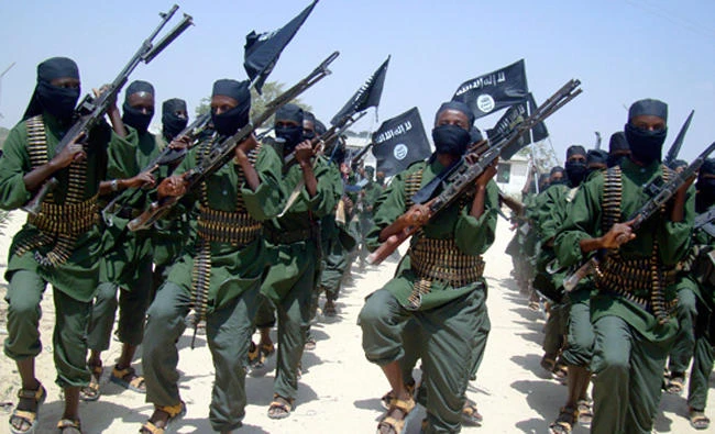 In this Feb. 17, 2011 file photo, al-Shabab fighters march with their weapons during military exercises on the outskirts of Mogadishu, Somalia. (AP)