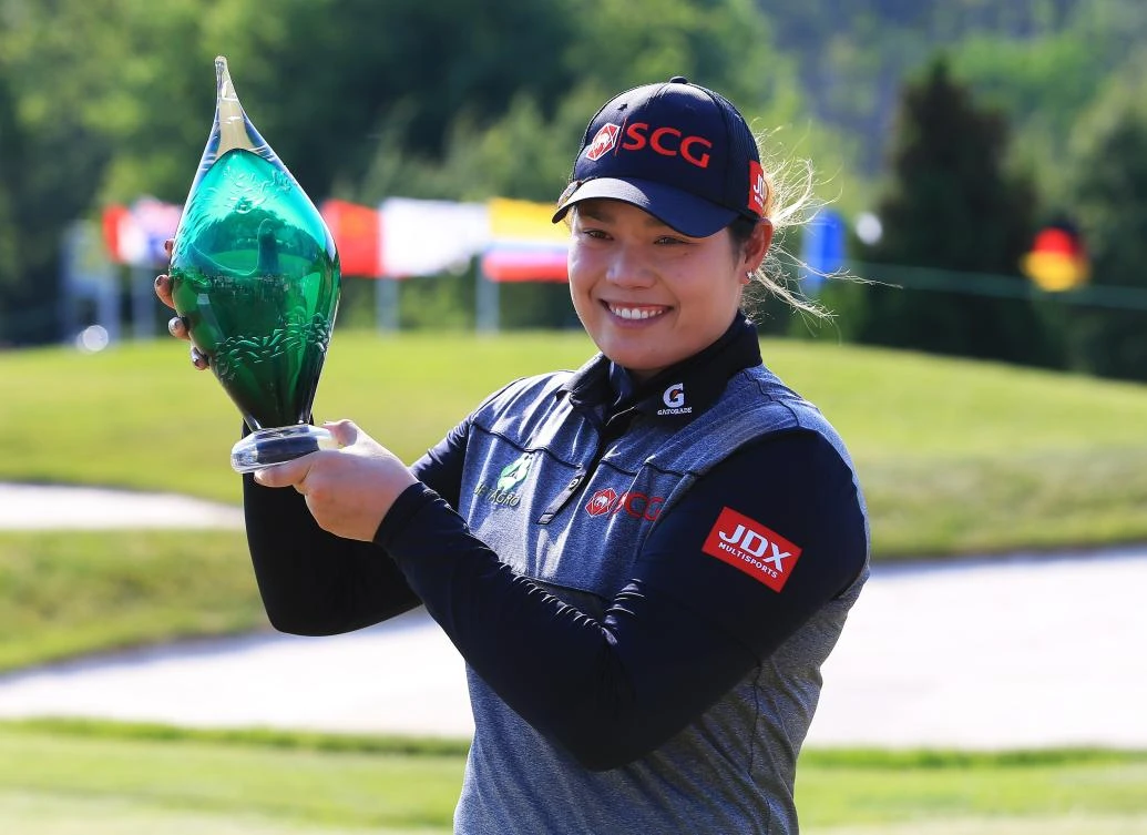 Ariya Jutanugarn of Thailand with the trophy after sinking her birdie putt on the 1st playoff hole to win during the final round of the Manulife LPGA Classic at Whistle Bear Golf Club on Sunday in Cambridge, Canada. (AFP)