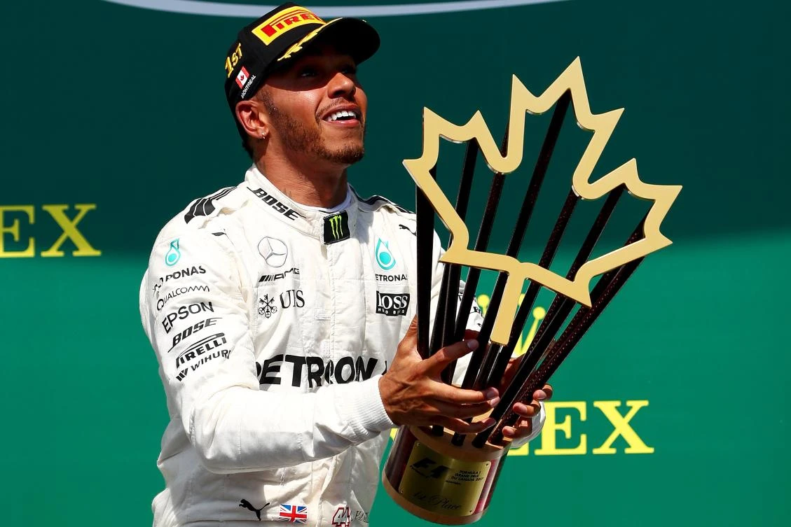 Lewis Hamilton of Great Britain and Mercedes GP celebrates on the podium after winning the Canadian Formula One Grand Prix at Circuit Gilles Villeneuve on Sunday in Montreal, Canada. (AFP)