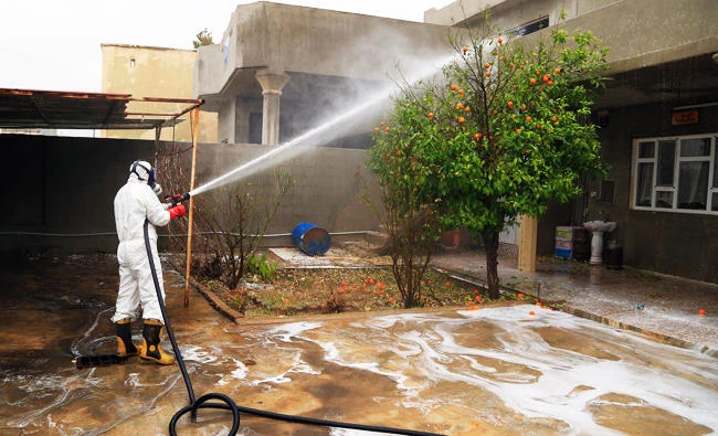 In this March 26, 2016 file photo, a firefighter cleans houses exposed to a chemical attack in Taza, 10 miles south of Kirkuk in northern Iraq. (AP)