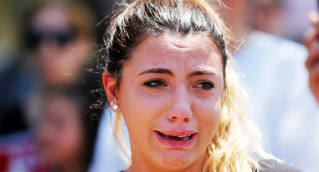 Chaldean-American Lavrena Kenawa cries as she thinks about her uncle who was seized on Sunday by Immigration and Customs Enforcement agents during a rally outside the Mother of God Catholic Chaldean church in Southfield, Michigan, U.S., on Monday. (REUTERS)