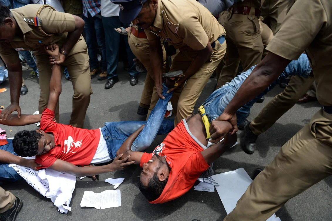 Indian police remove members of the Revolutionary Students and Youth Front during a protest against Prime Minister Narendra Modi and a ban on the sale of cows for slaughter in Chennai. (AFP)