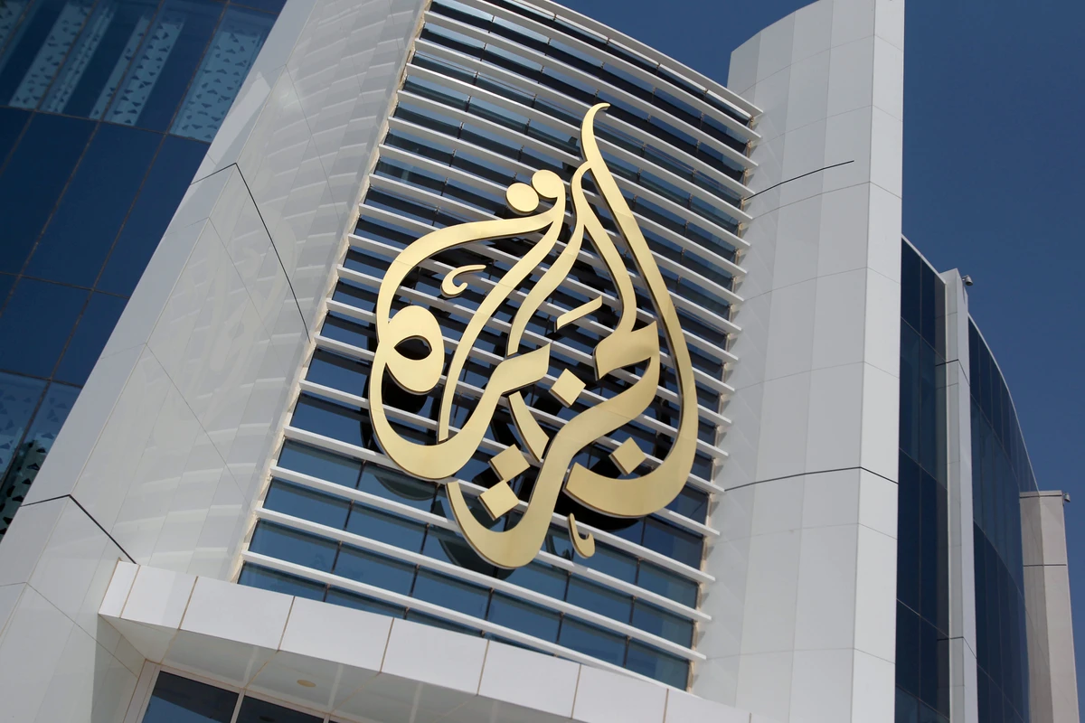 The logo of Al Jazeera Media Network is seen on its headquarters building in Doha, Qatar on June 8, 2017. (REUTERS)