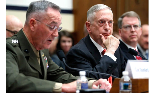 Joint Chiefs Chairman Gen. Joseph Dunford, left, speaks as Defense Secretary Jim Mattis, and Defense Under Secretary and Chief Financial Office David Norquist, listen during a House Armed Services Committee hearing on the FY'18 defense budget, on Capitol Hill in Washington on Monday. (AP