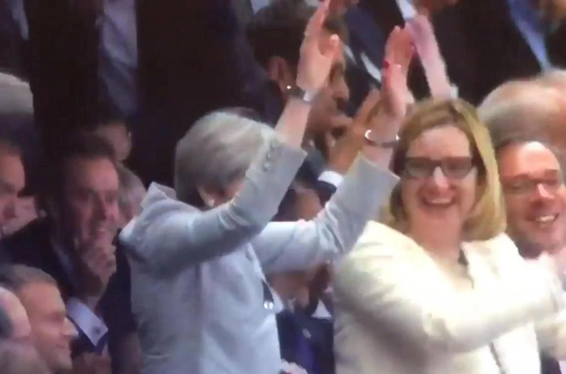 British Prime Minister Theresa May is making waves online over her attempt to take part in a Mexican wave. (Photo courtesy: Twitter)