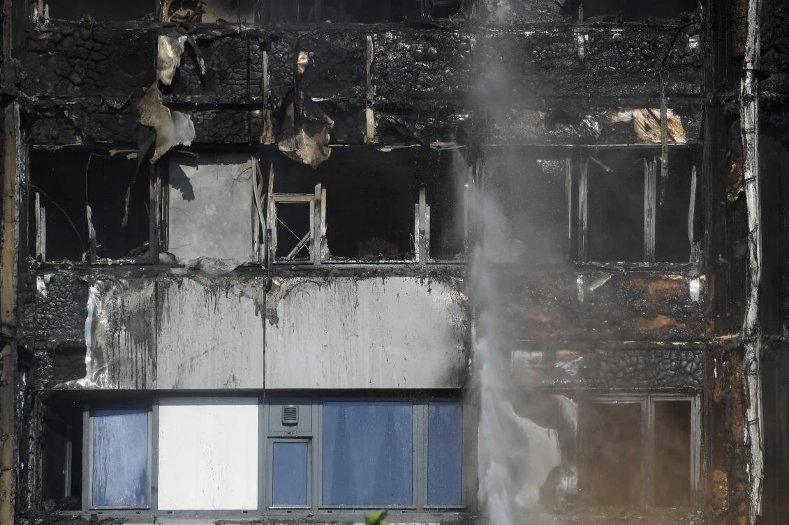 Smoke is seen in front of a tower block severely damaged by a serious fire, in north Kensington, West London, Britain June 14, 2017. (Photo: Reuters/Toby Melville)
