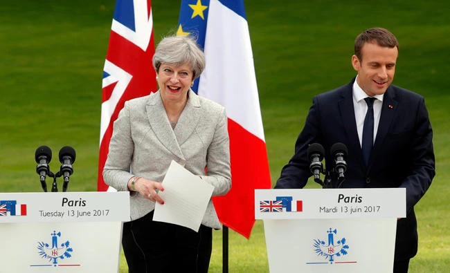 French President Emmanuel Macron, right, and Britain's Prime Minister Theresa May attend a joint press conference at the Elysee Palace in Paris Tuesday. (Reuters)