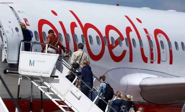 Passengers board a German carrier Air Berlin aircraft at Tegel airport in Berlin, Germany, on Wednesday. (REUTERS)