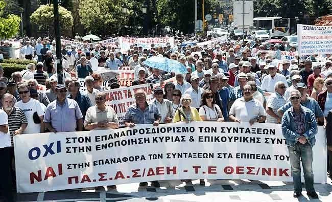 Pensioners from central and northern Greece hold a banner against pension cuts as they march during a demonstration in Thessaloniki on Tuesday. (AFP)