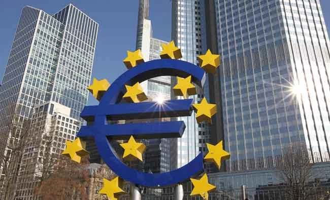 This file photo taken on February 15, 2017 shows German artist Ottmar Hoerl's sculpture depicting the Euro logo is pictured in front of the former headquarter of the European Central Bank (ECB) in Frankfurt. (AFP)
