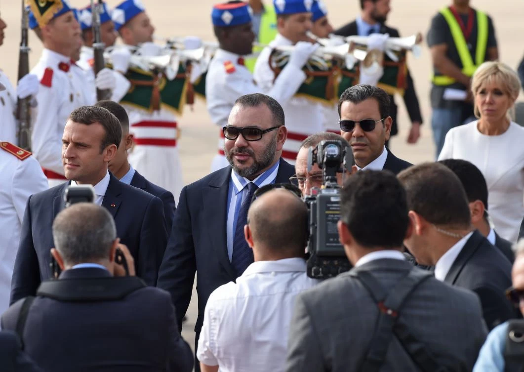 French President Emmanuel Macron and Moroccan King Mohammed VI walk during a welcome ceremony at the airport in Rabat on June 14, 2017. Macron is on an official visit to Morocco. (AFP)