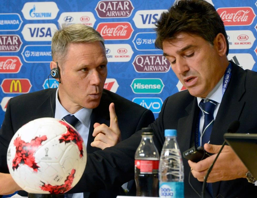 FIFA Chief Technical Development Officer Marco van Basten, left, speaks with FIFA Head of Refereeing Massimo Busacca during a press conference outlining some of the new rules set to be featured at the Confederation Cup football tournament, including Video Assistant Referees, on Thursday at Krestovsky Stadium in Saint-Petersburg. (AFP)