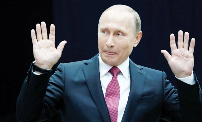 Russian President Vladimir Putin gestures as he speaks to journalists following a live nationwide broadcast call-in in Moscow on Thursday. (Reuters)