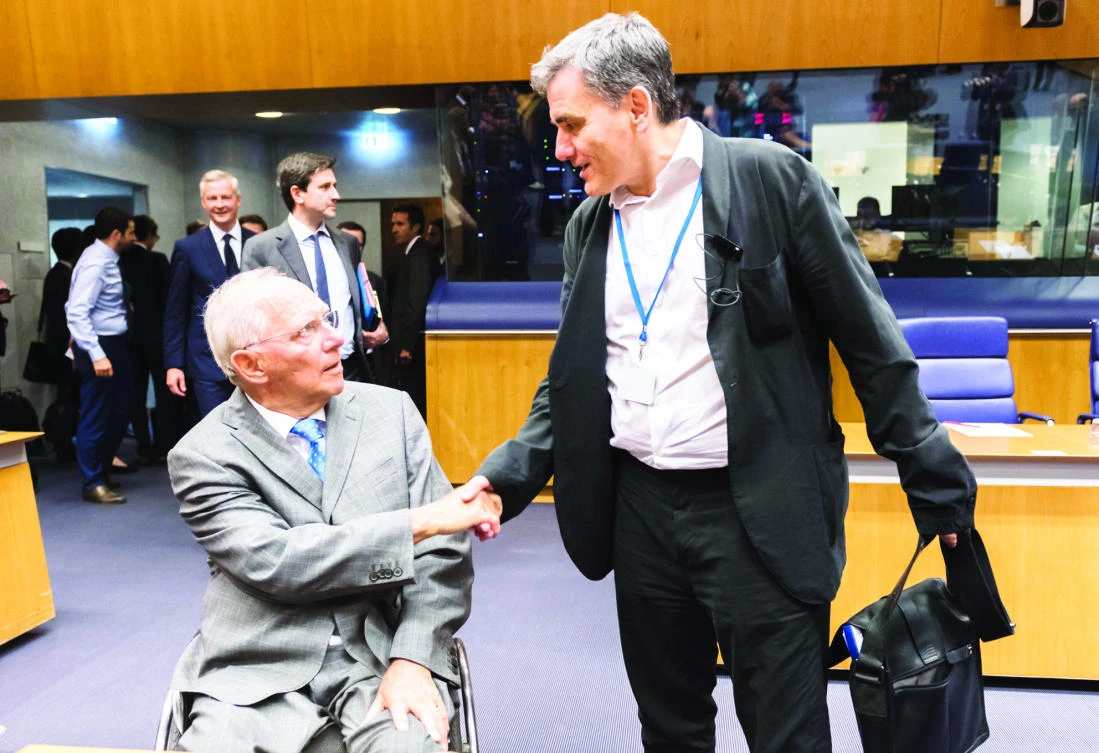 German Finance Minister Wolfgang Schaeuble, left, greets Greek Finance Minister
Euclid Tsakalotos during a meeting in Luxembourg on Thursday. (AP)