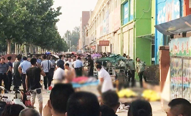 This screengrab taken from a broadcast by China's State broadcaster CCTV on June 15, 2017, shows the aftermath of an explosion outside a kindergarten in the eastern Chinese city of Xuzhou. (AFP)