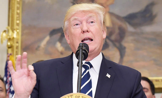 President Donald Trump speaks in the Roosevelt Room of the White House in Washington, on Thursday, during an event on Apprenticeship and Workforce of Tomorrow initiatives. (AP)