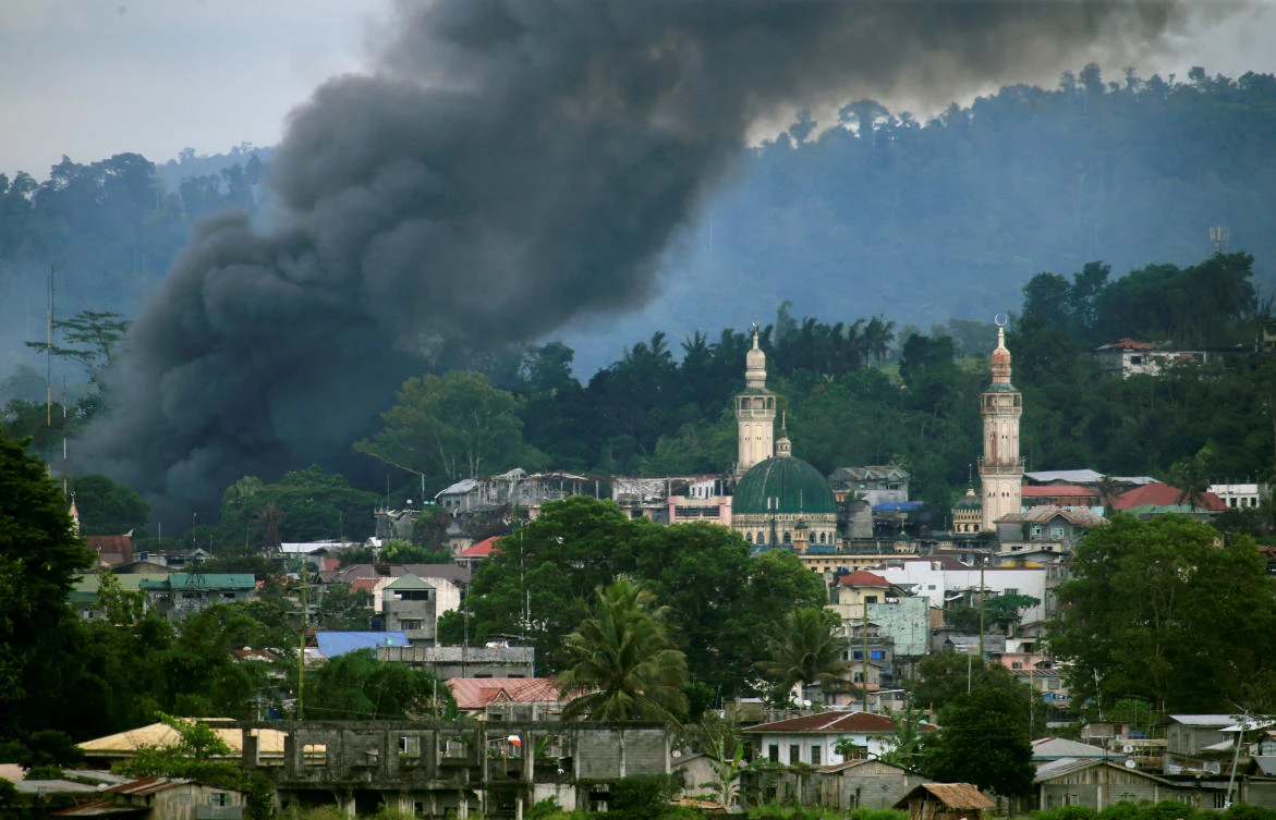 Smoke billows from a building as government troops continue their assault against insurgents in Marawi City, Philippines, on Friday. (Reuters)