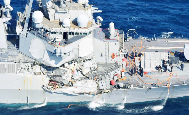 The Arleigh Burke-class guided-missile destroyer USS Fitzgerald, damaged by colliding with a Philippine-flagged merchant vessel, is seen off Shimoda, Japan in this photo taken by Kyodo on June 17, 2017. (Reuters)