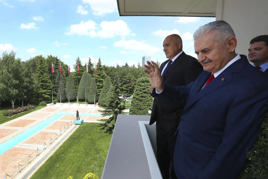 An adviser to Prime Minister Binali Yildirim, right, was released by Turkey after detention over links to US-based Fethullah Gulen. (AP)