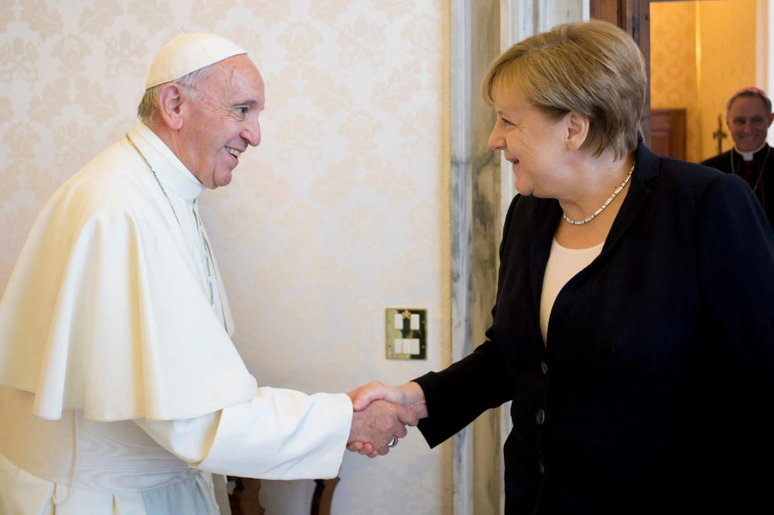 Pope Francis greets German Chancellor Angela Merkel. (Osservatore Romano/Handout via Reuters)
