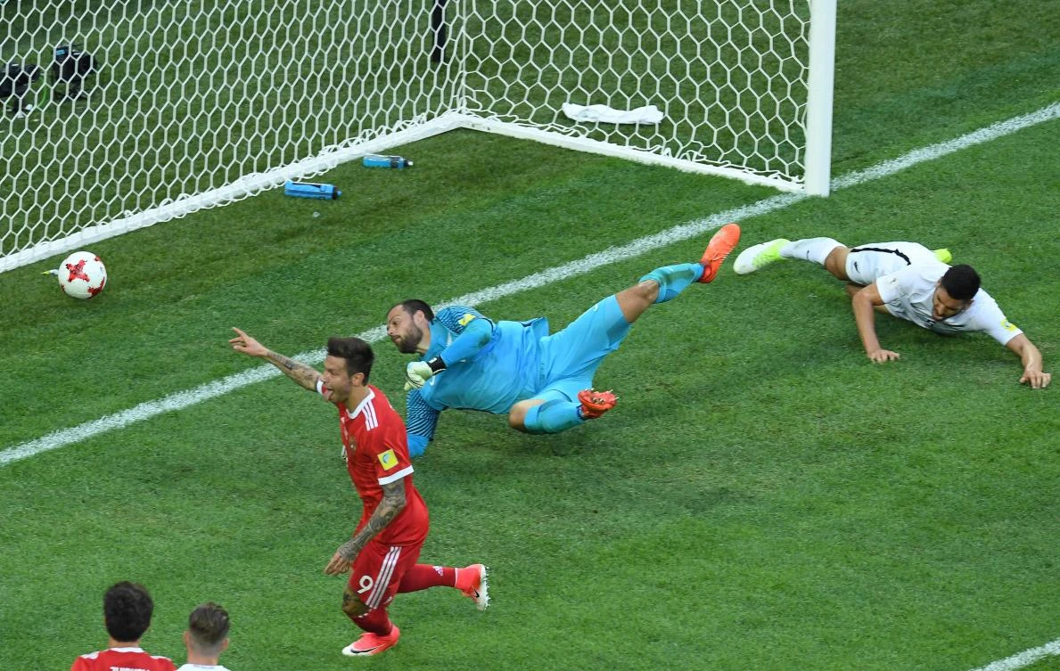 Russia's forward Fedor Smolov, left, celebrates as he scores the team's second goal during the 2017 Confederations Cup group A football match between Russia and New Zealand at the Krestovsky Stadium in Saint-Petersburg on Saturday. (AFP)