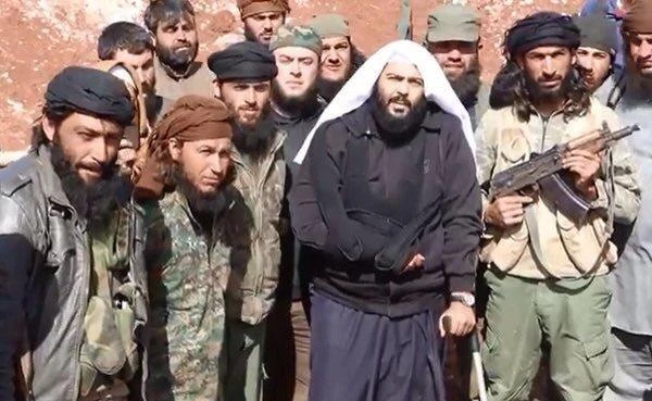 Preacher Abdullah Al-Muhaysini (center) and his Al-Nusra Front cohorts are seen in a picture shared on Twitter on Saturday after he reportedly survived an assassination attempt somewhere in Syria. (Abdul Khasan via Twitter)