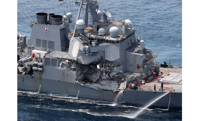 Damage is seen on the guided missile destroyer USS Fitzgerald off the Shimoda coast, after it collided with a Philippine-flagged container ship, on June 17, 2017. (AFP / JIJI PRESS)