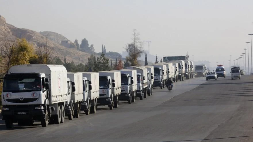 A convoy of trucks loaded with humanitarian supplies are seen heading to the besieged town of Madaya, some 24 km in southwest Damascus, Syria. (AP)