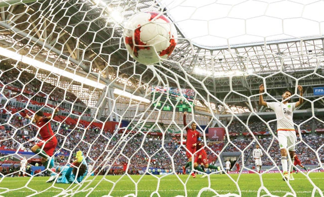 Portugal's Cedric Soares, scores his side's second goal during the 2017during the Confederations Cup Group A soccer match between Portugal and Mexico, at the Kazan Arena, Russia, Sunday. (AP)