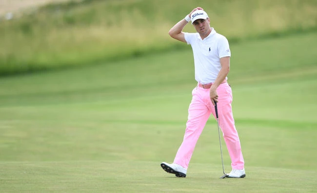 Justin Thomas walks up to the applause of the crowd on the 18th green during the third round of the US Open golf tournament at Erin Hills on Saturday. (USA TODAY Sports)