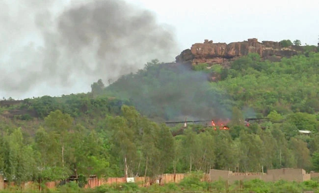 Flames rise following an attack where gunmen stormed Le Campement Kangaba resort in Dougourakoro, to the east of the capital Bamako, Mali in this still frame taken from video on Sunday. (REUTERS)