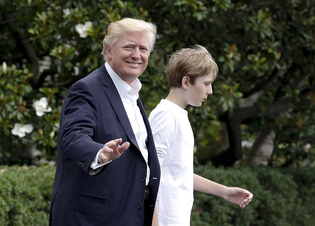 President Donald Trump and his son Barron Trump walk to Marine One across the South Lawn of the White House in Washington, Saturday, June 17, 2017, en route to Camp David in Maryland. (AP)
