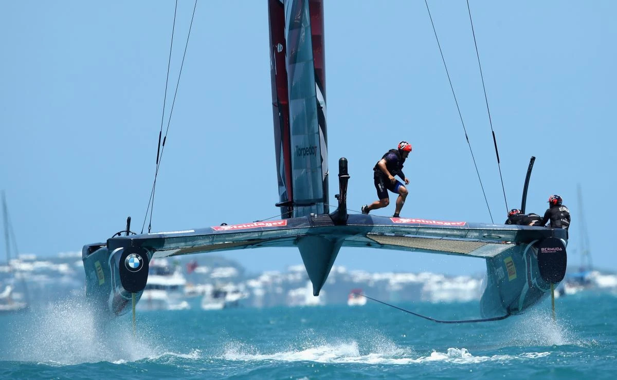 Helmsman Peter Burling and the rest of the Emirates Team New Zealand race against Oracle Team USA in race three on Day 2 of the America's Cup Match Presented by Louis Vuitton on Sunday in Hamilton, Bermuda. (AFP)