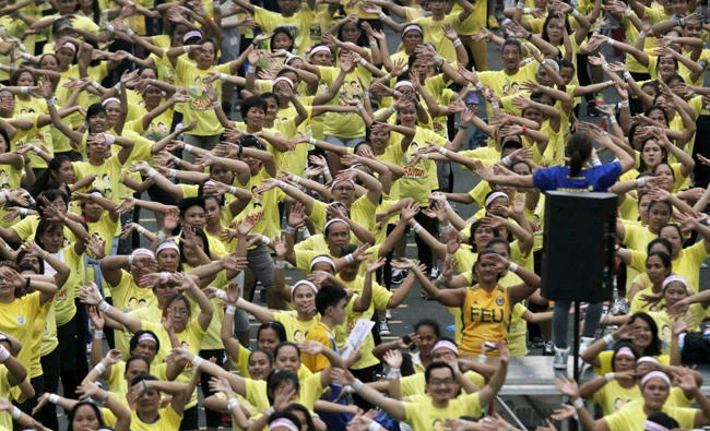 In this July 19, 2015 photo, thousands of Filipino health enthusiasts dance to high tempo music as they participate in a Guinness World Records attempt for the largest Zumba class held along the main streets of Mandaluyong city, metro Manila. Iran's clerics have outlawed Zumba, calling it sinful. (Reuters file photo)