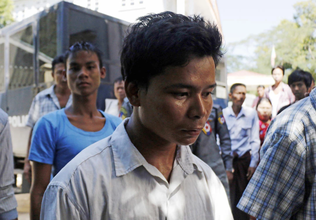 In this Nov. 18, 2016, photo, self-styled exorcist Tun Naing, center, arrive at a district court to hear his first trial in Thanlyin township, south of Yangon, Myanmar. The court has sentenced Tun Naig to death for killing three children during a ritual he carried out after telling their parents their offspring were possessed by evil spirits. (AP)
