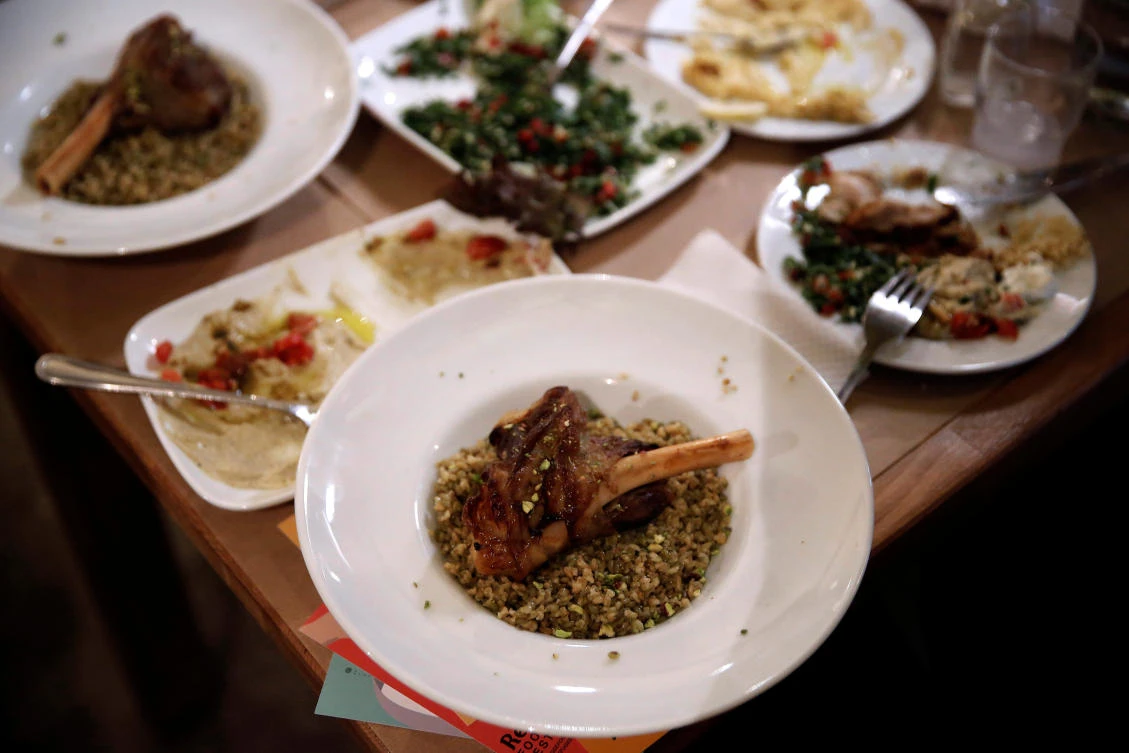 Traditional Syrian dishes are seen on a table during the Refugee Food Festival in Athens, Greece June 19, 2017. Picture taken June 19, 2017. (REUTERS)
