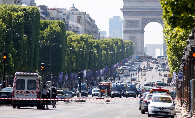 Four family members of the man who was killed have been detained after his attack on the Champs-Elysees. (AP)