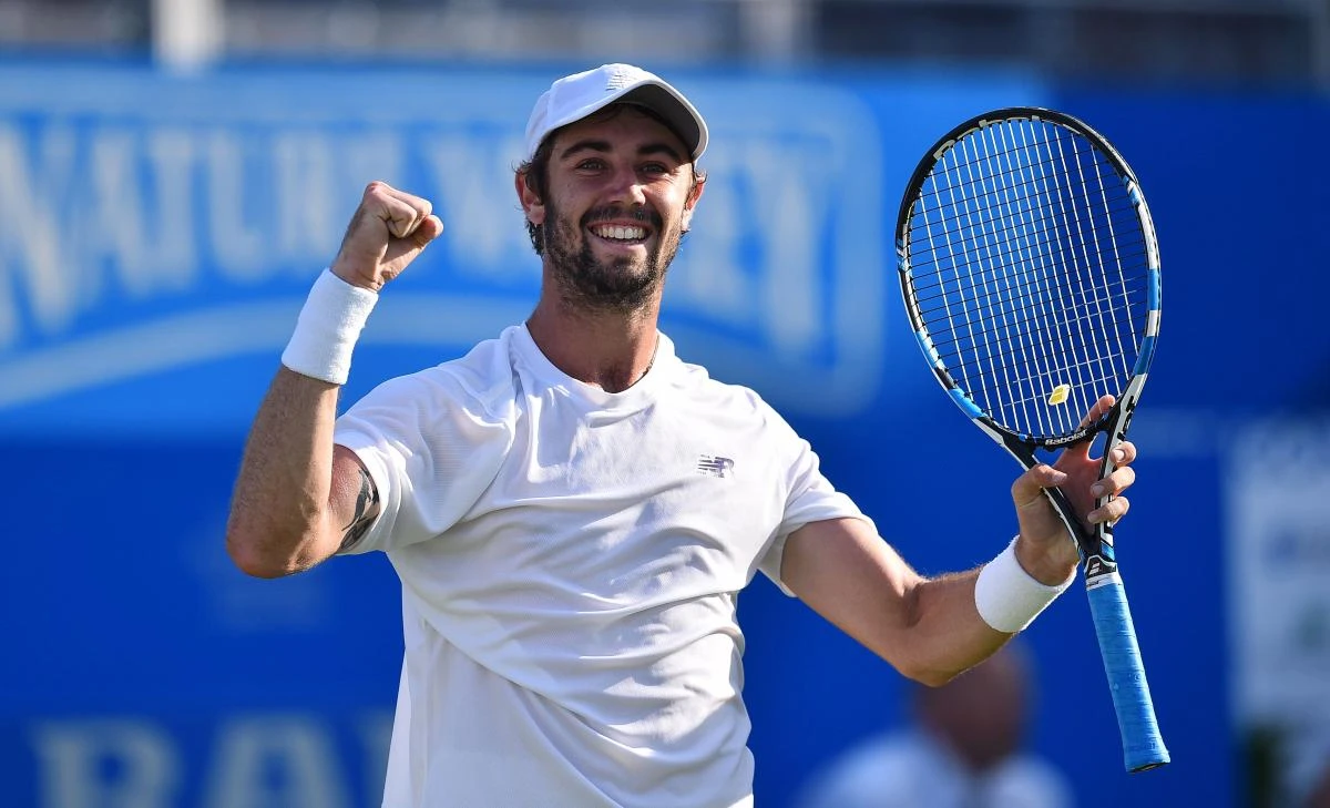 Australia's Jordan Thompson celebrates winning his first round match against Britain's Andy Murray during at the ATP Aegon Championships tennis tournament at Queen's Club in west London on Tuesday. (AFP)