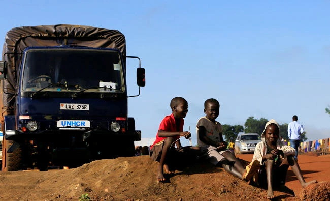 Children displaced by war in South Sudan play by a UN High Commissioner for Refugees truck at the Palabek Refugee Settlement Camp in Lamwo district, Uganda, recently. (Reuters)